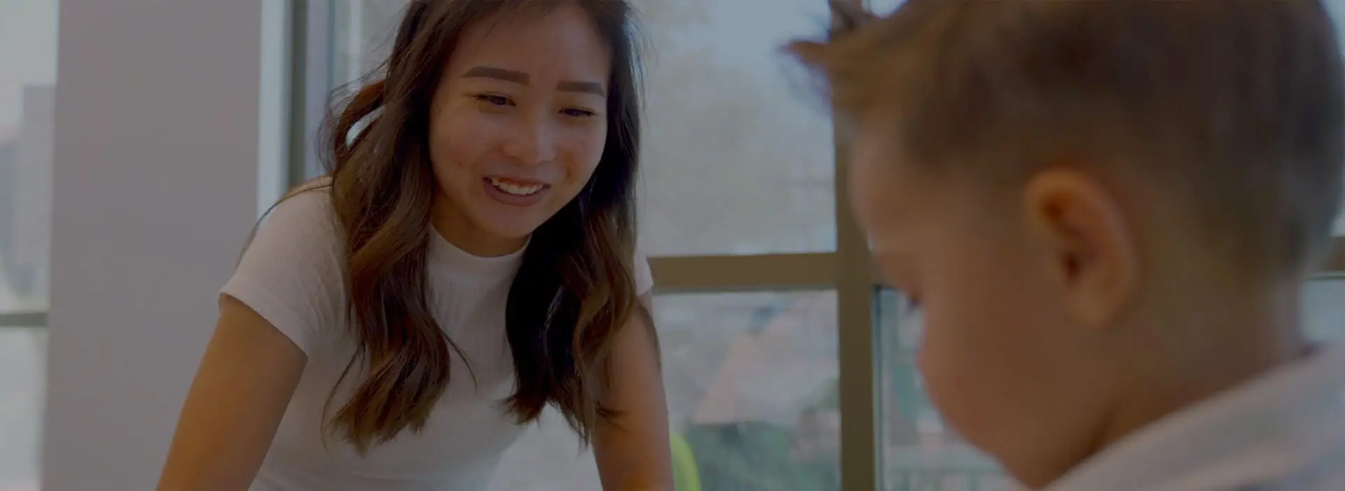 Therapist working one-on-one with a child during a behavioral intervention session.